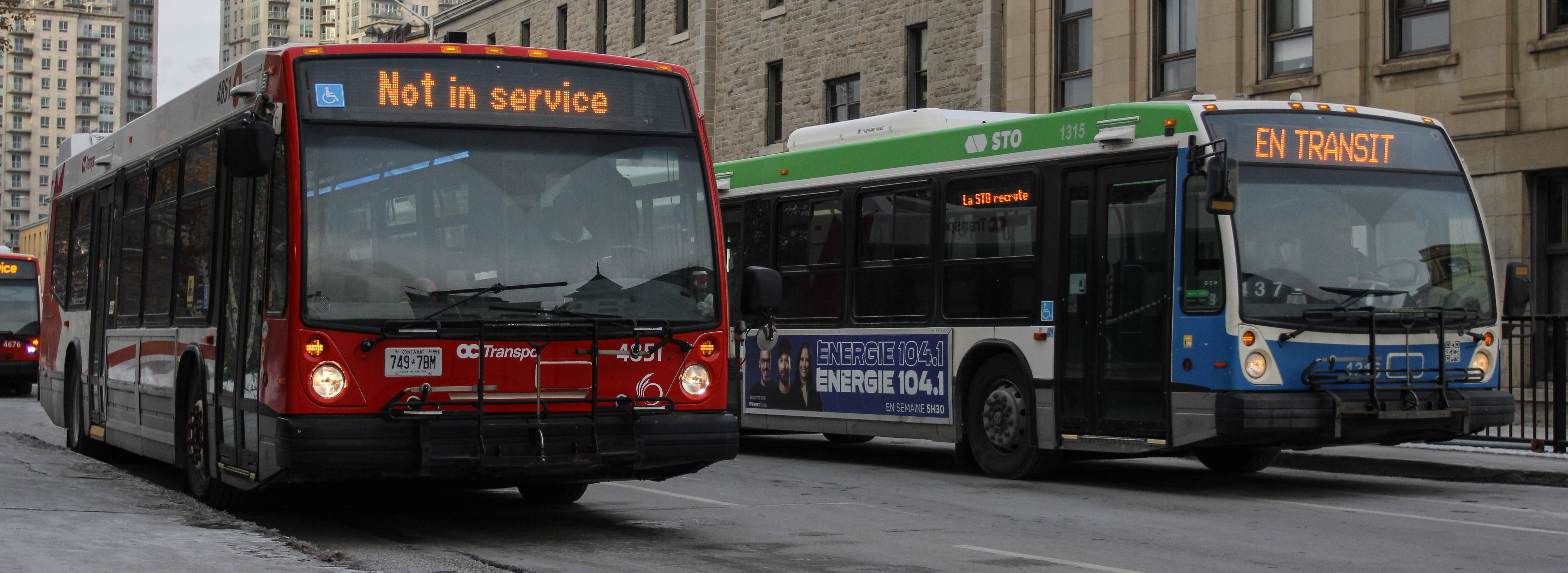 OC Transpo bus 4451, our new used bus, next to an STO bus